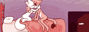 Lucy kneels on the bed, cradling Paulo's head in both hands and kissing him while his palms stay flat on the comforter.